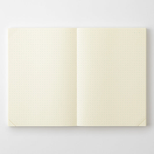 Open MD Notebook A5 Codex showing cream dot-grid pages and perforated lower corners.