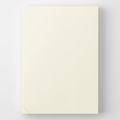 Beige Midori notebook on a white background