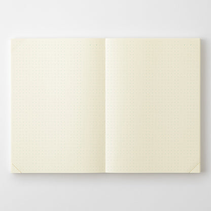 Open notebook with cream-colored pages on a light gray background