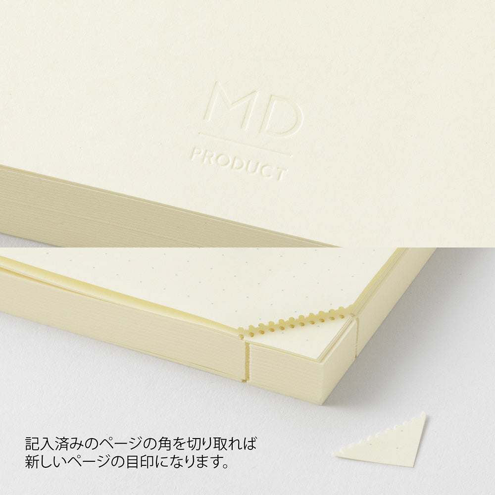Beige notebook with a corner cutout feature on a light gray background