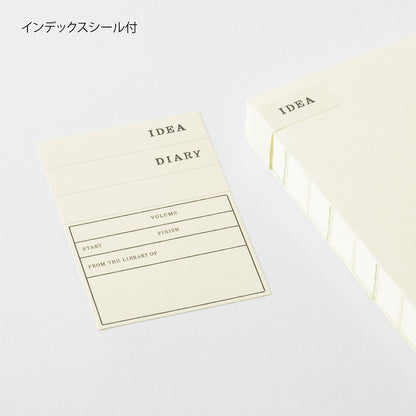 Idea Diary with a white cover on a light gray background