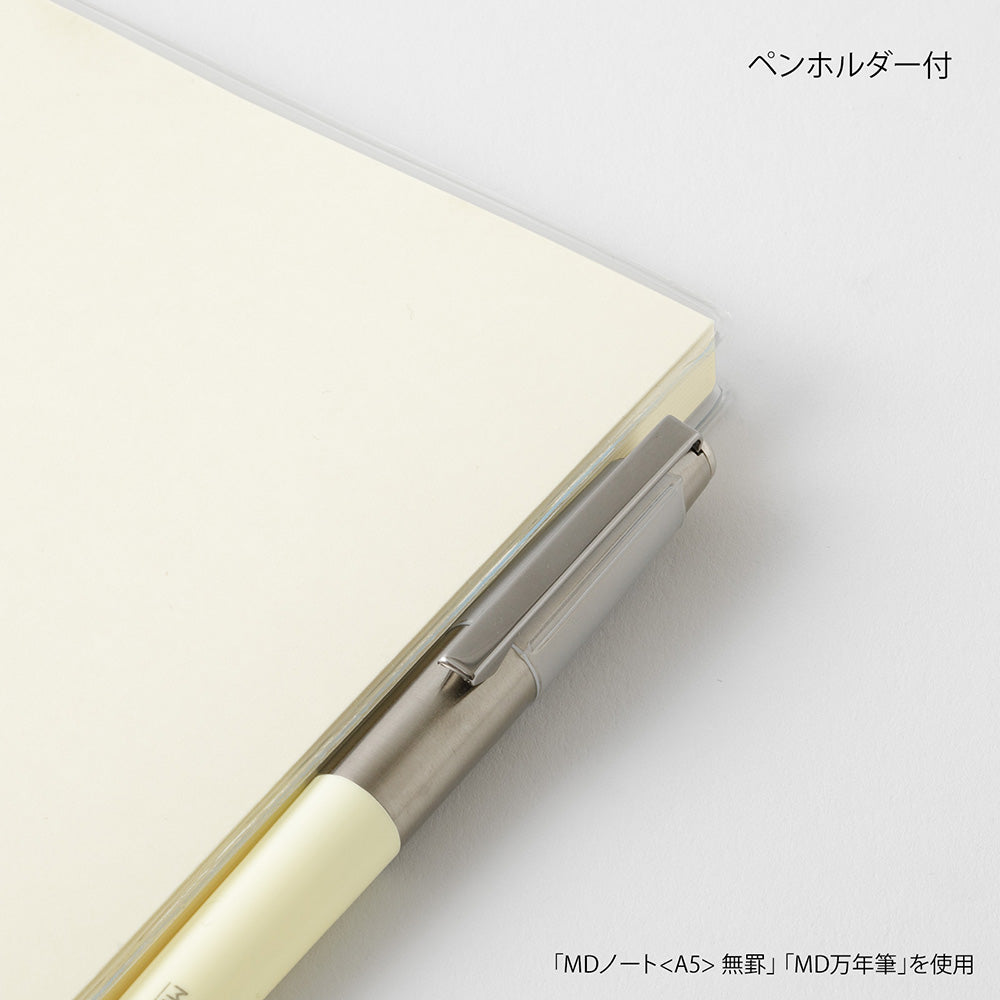 Pen holder attached to a notebook on a white background