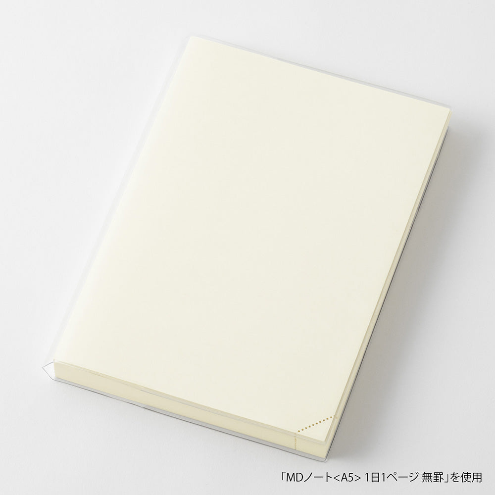 Beige Midori notebook on a white background