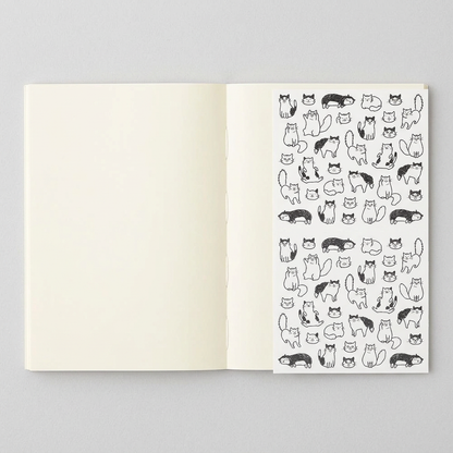 Blank variant: open MD A6 notebook with blank pages and Chat Cat sticker sheet