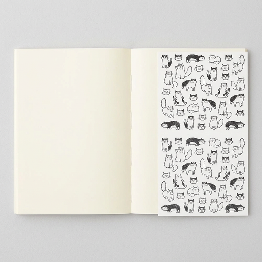 Blank variant: open MD A6 notebook with blank pages and Chat Cat sticker sheet